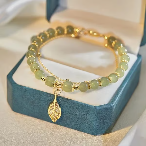 Exquisite Hetian Jade Bracelet with Gold Leaf – the Perfect Gift for Your Loved One.