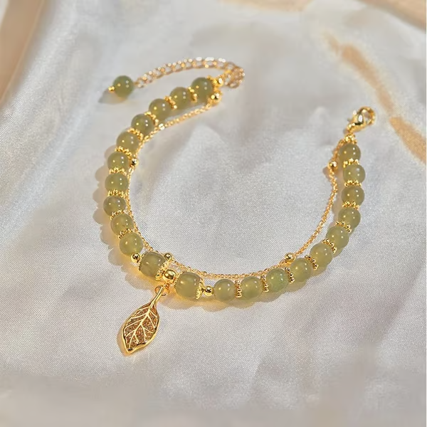 Exquisite Hetian Jade Bracelet with Gold Leaf – the Perfect Gift for Your Loved One.