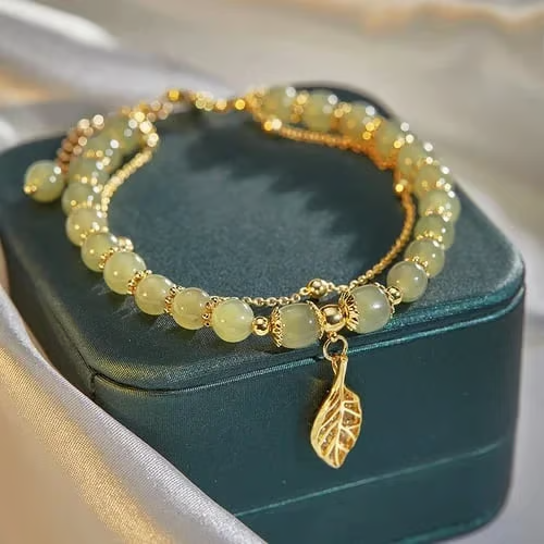 Exquisite Hetian Jade Bracelet with Gold Leaf – the Perfect Gift for Your Loved One.