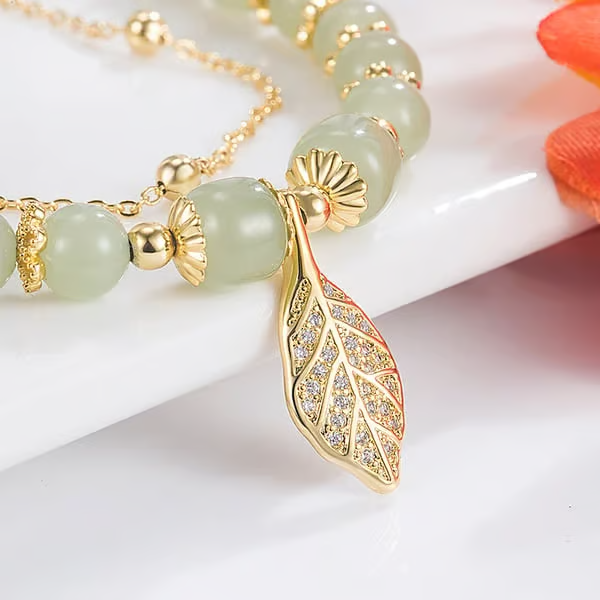 Exquisite Hetian Jade Bracelet with Gold Leaf – the Perfect Gift for Your Loved One.